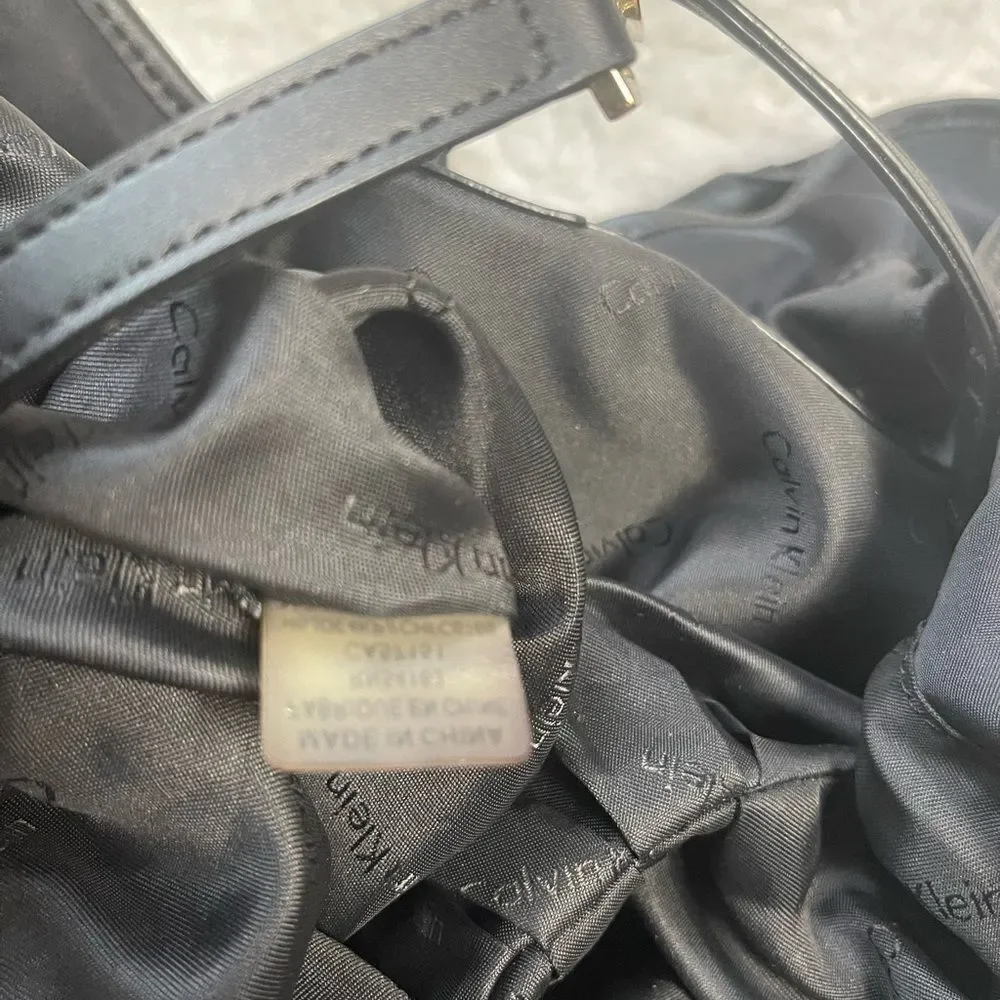 Calvin Klein Black Nylon large shoulder bag with gold tone hardwares.